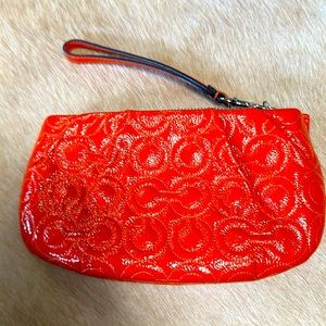 Coach - orange patent wristlet